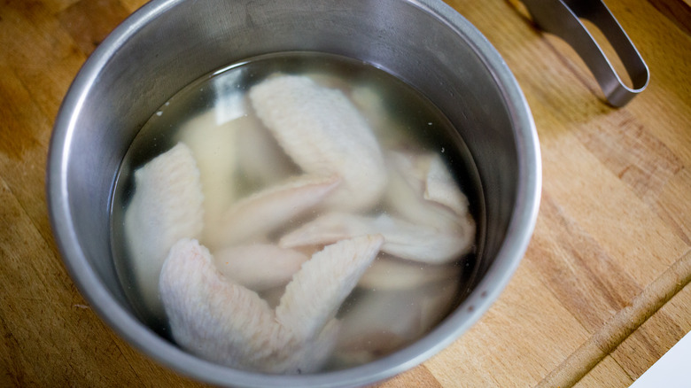 chicken in pot of brine