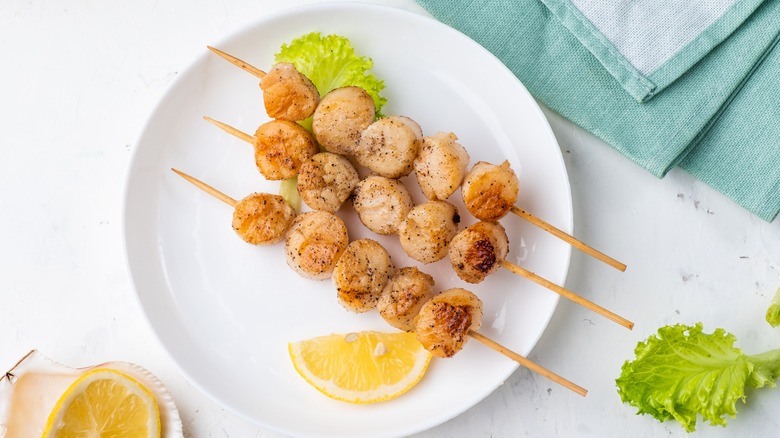 Skewers of grilled scallops