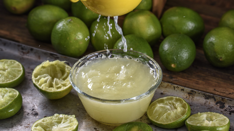 squeezing lime juice into bowl