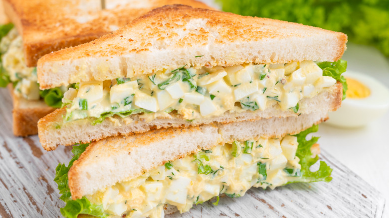 Egg salad sandwich sliced in half