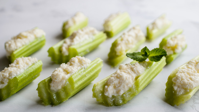 Cut celery filled with cream cheese