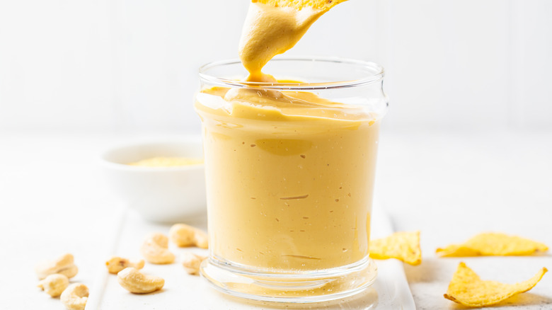 Glass jar of cheese sauce