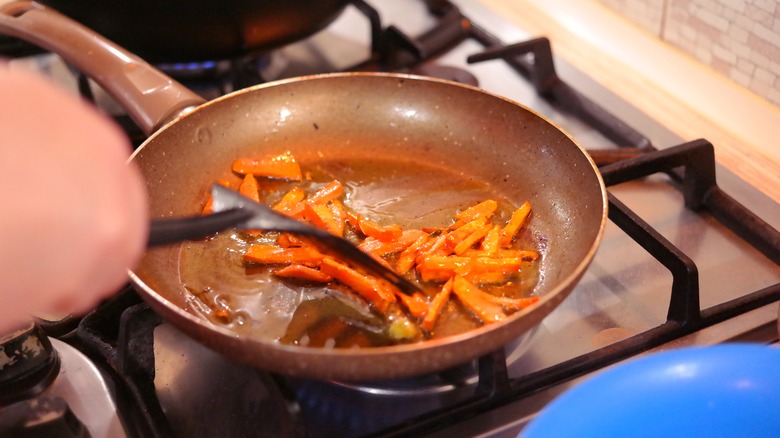 Carrots sautéed in pan