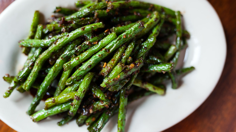 Roasted green beans on plate