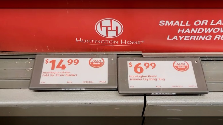 Pair of Aldi price tags on shelf, both with a white label and red writing, indicating Aldi Finds products