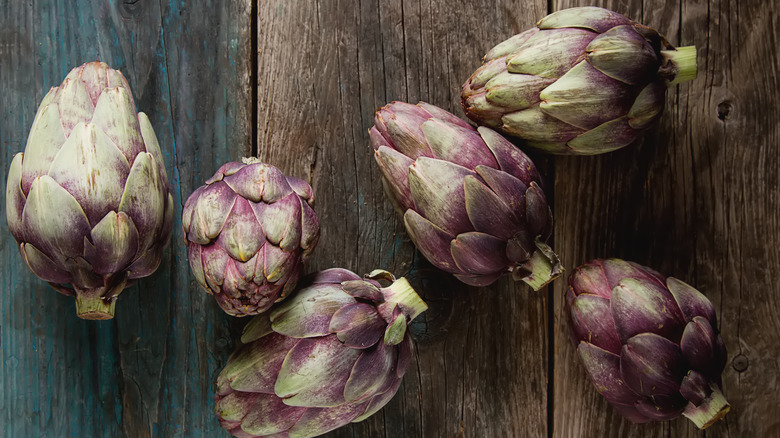 baby artichokes on wood