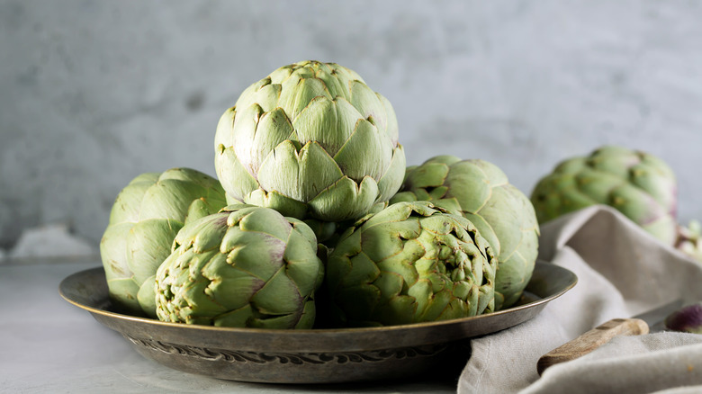 plate of green artichokes