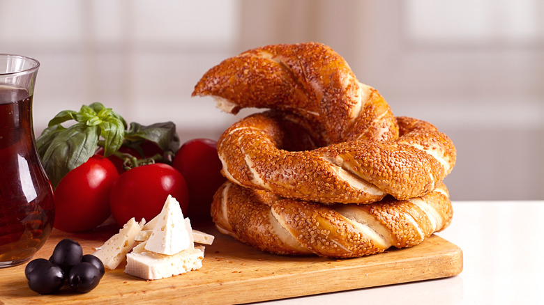 golden bagel on wooden board