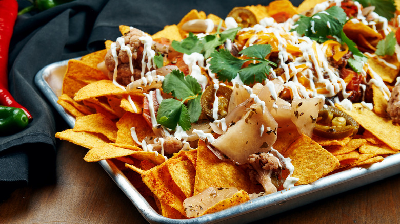 sheet pan of loaded nachos