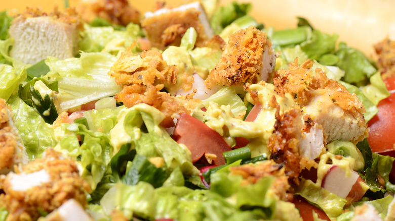 salad with fried chicken pieces