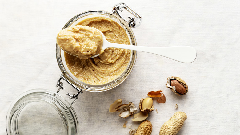 natural peanut butter and spoon