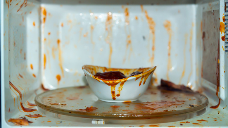 microwave splattered with food inside