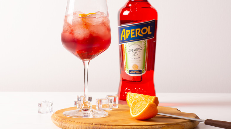 bottle of aperol with cocktail