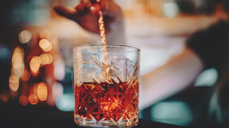 bartender stirring cocktail