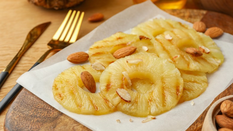 cooked pineapple slices with almonds