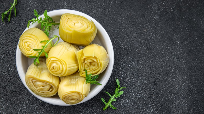 canned artichoke hearts on plate