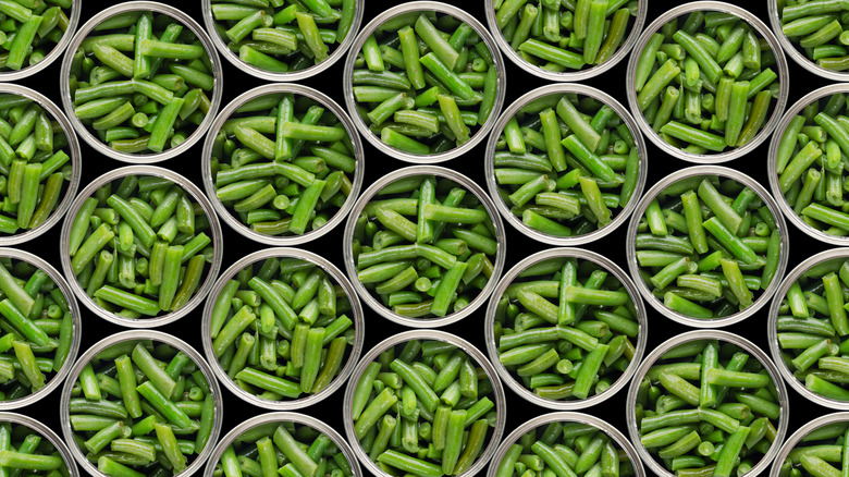 Open cans of green beans