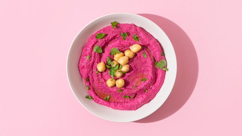 beetroot hummus on pink background