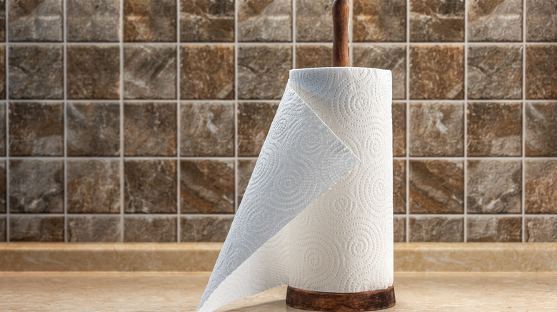 Paper towel roll on wooden holder