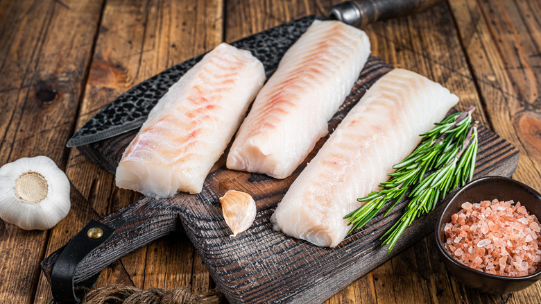 Cod fillets on cutting board