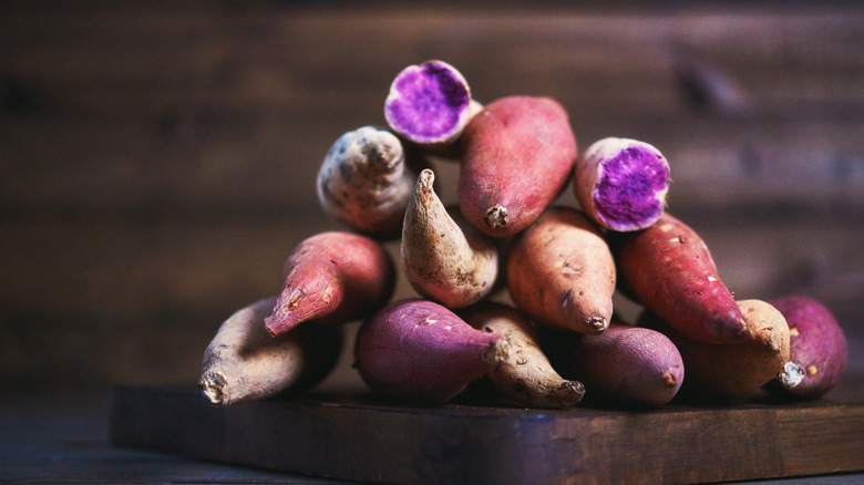 pile of various sweet potatoes