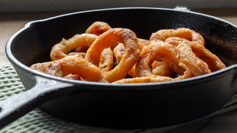 onion rings in cast iron pan