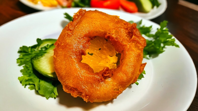 onion ring on plated salad