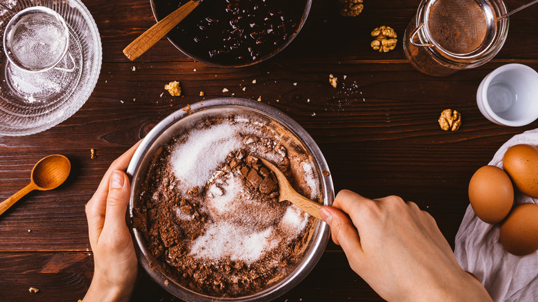 mixing batch of brownies