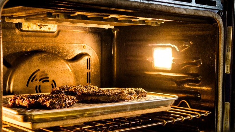 Steaks broiling in oven