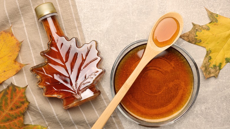 Maple syrup in bottle and dish