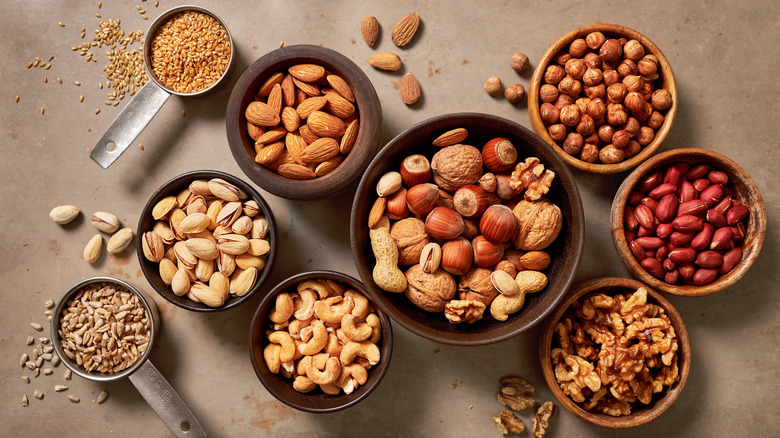 Nuts and seeds in small bowls