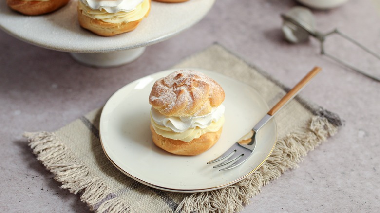 Cream puff on white plate