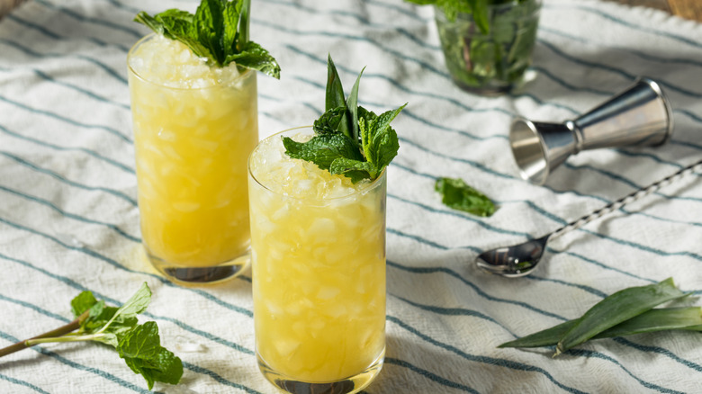 Chartreuse Swizzle cocktails on table