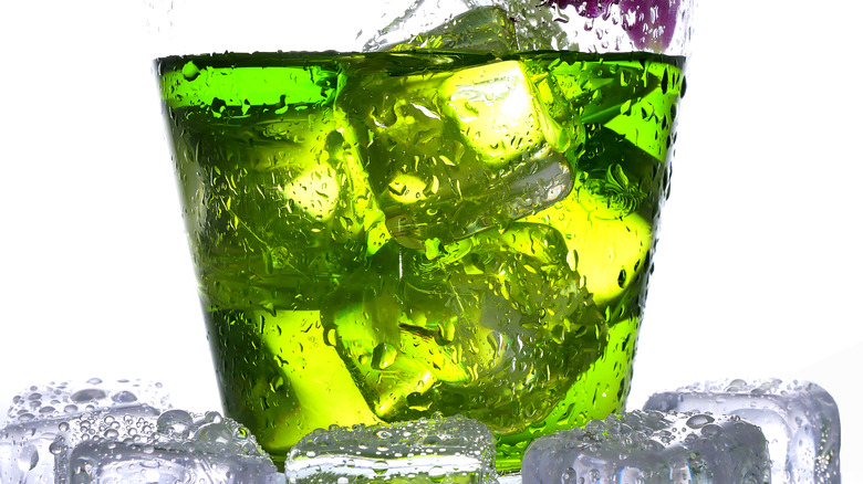 Green-colored cocktail on ice