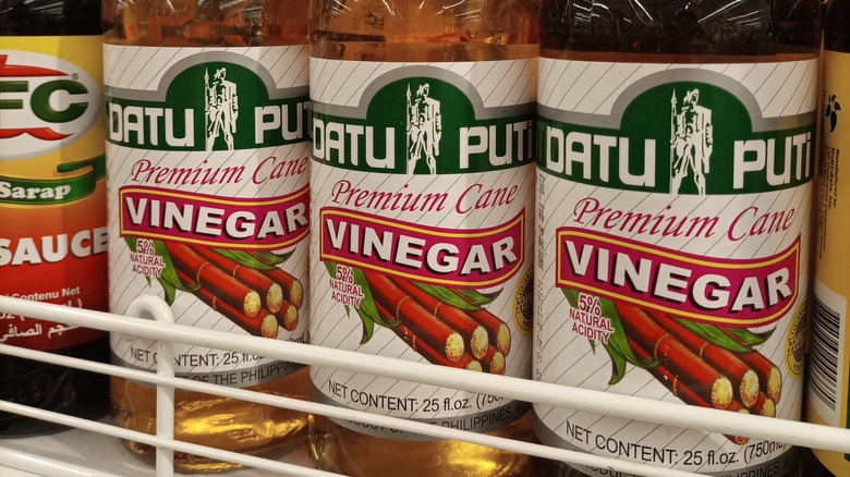 Bottles of cane vinegar in supermarket