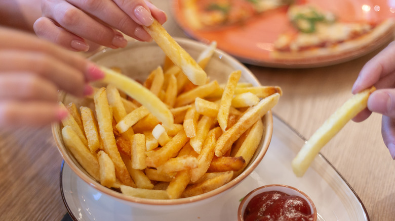 people eating French fries