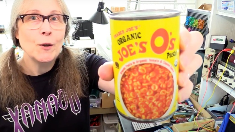 woman holding Trader Joe's O's