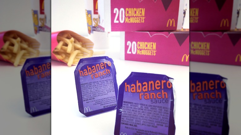 McDonald's Habanero Ranch Sauce packets, in front of McDonald's Chicken Nuggets and Fries