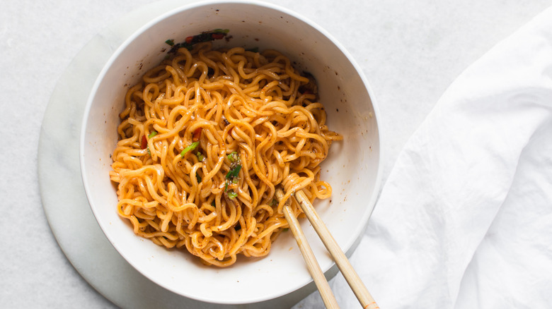 Bowl of instant ramen noodles with chopsticks