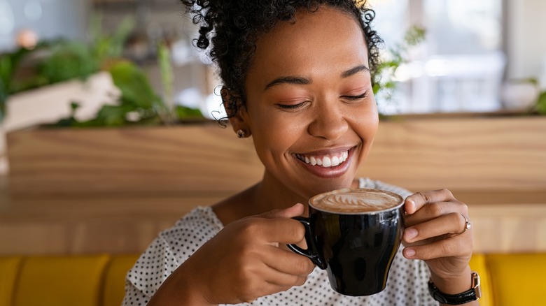 Woman enjoying hot coffee