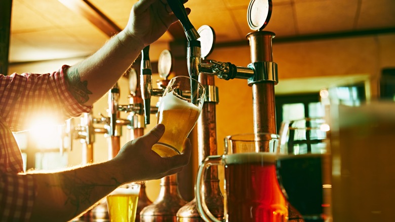 Bartender pouring draft beer