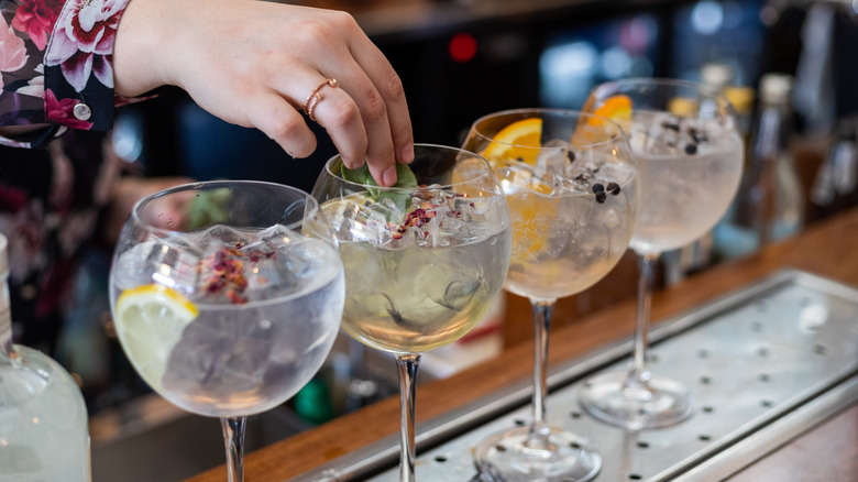 Bartender garnishing cocktails