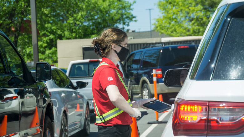 Drive-thru worker taking order