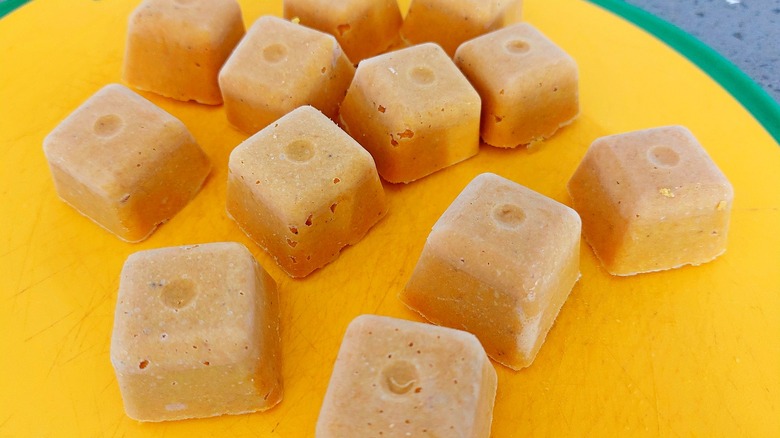 Chicken bouillon cubes on yellow plate