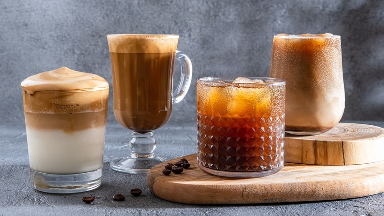 four cold drinks in glasses