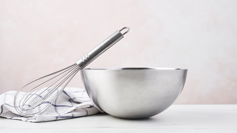 metal mixing bowl and whisk