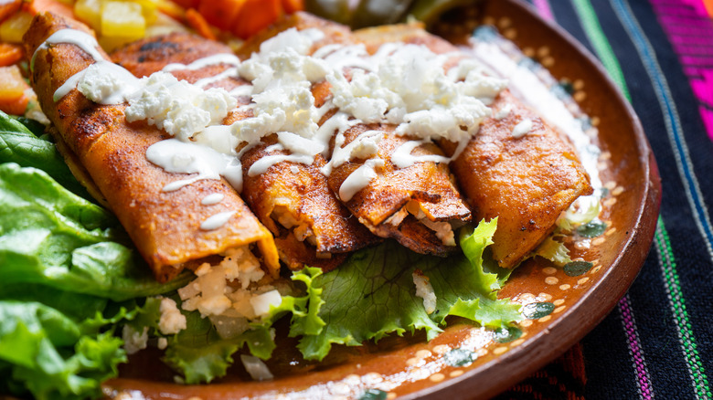 enchiladas with crumbled cheese 