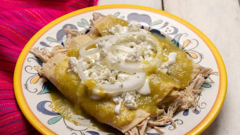 green enchiladas on white plate 