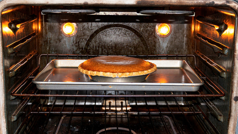 Pumpkin pie in oven