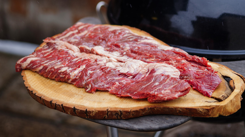 raw hanger steak on wood